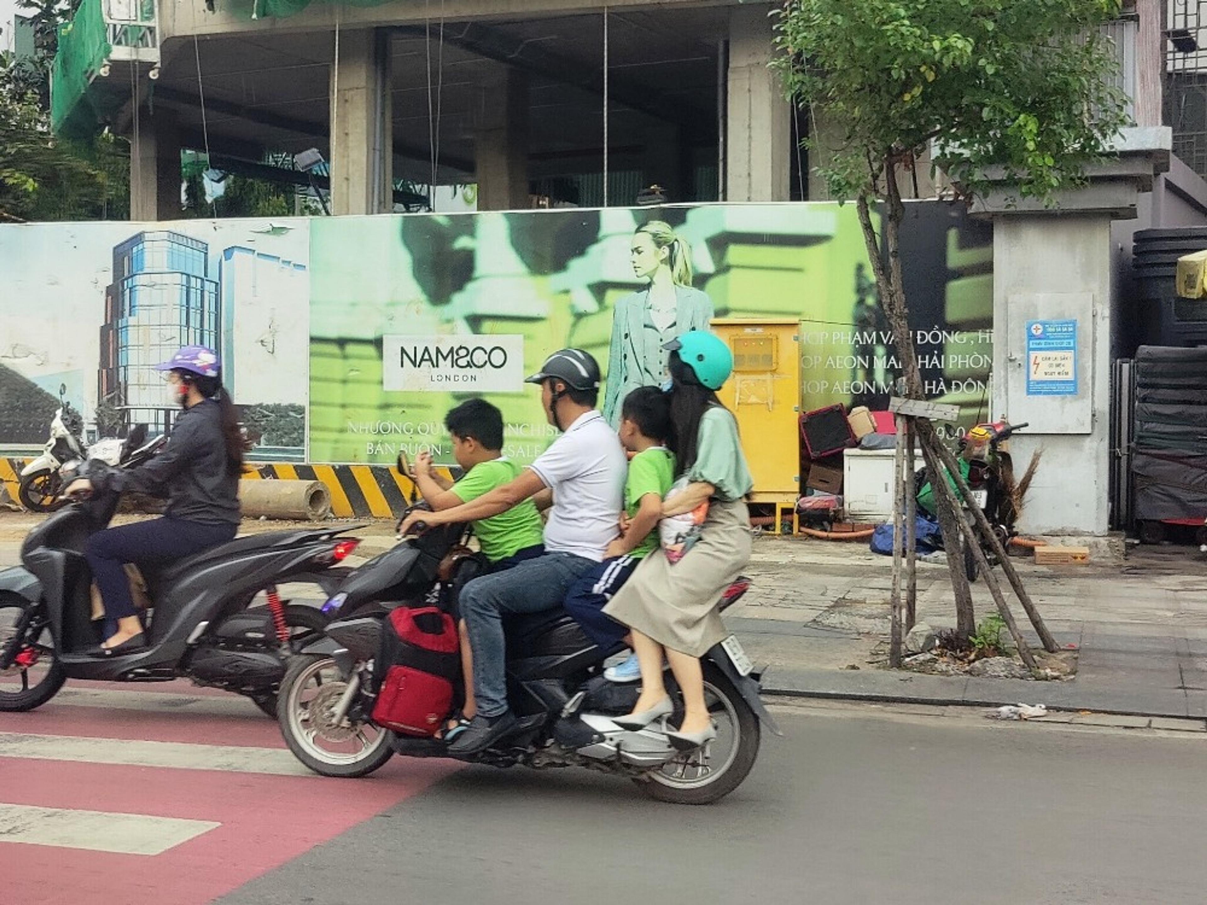 Moped carrying 4 people