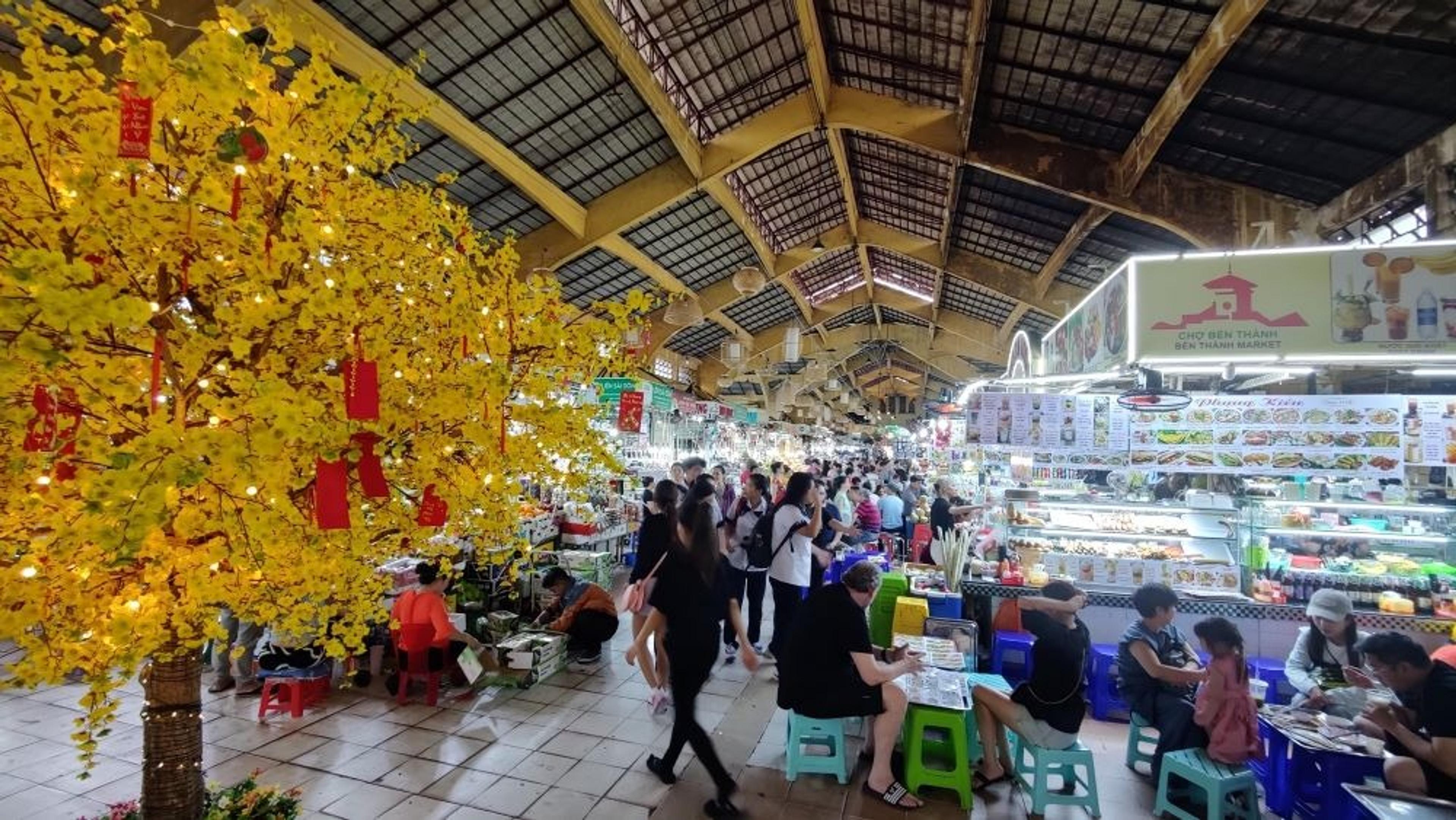 Yellow tree with red decoration inside Ben Thanh Market, Ho Chi Minh City