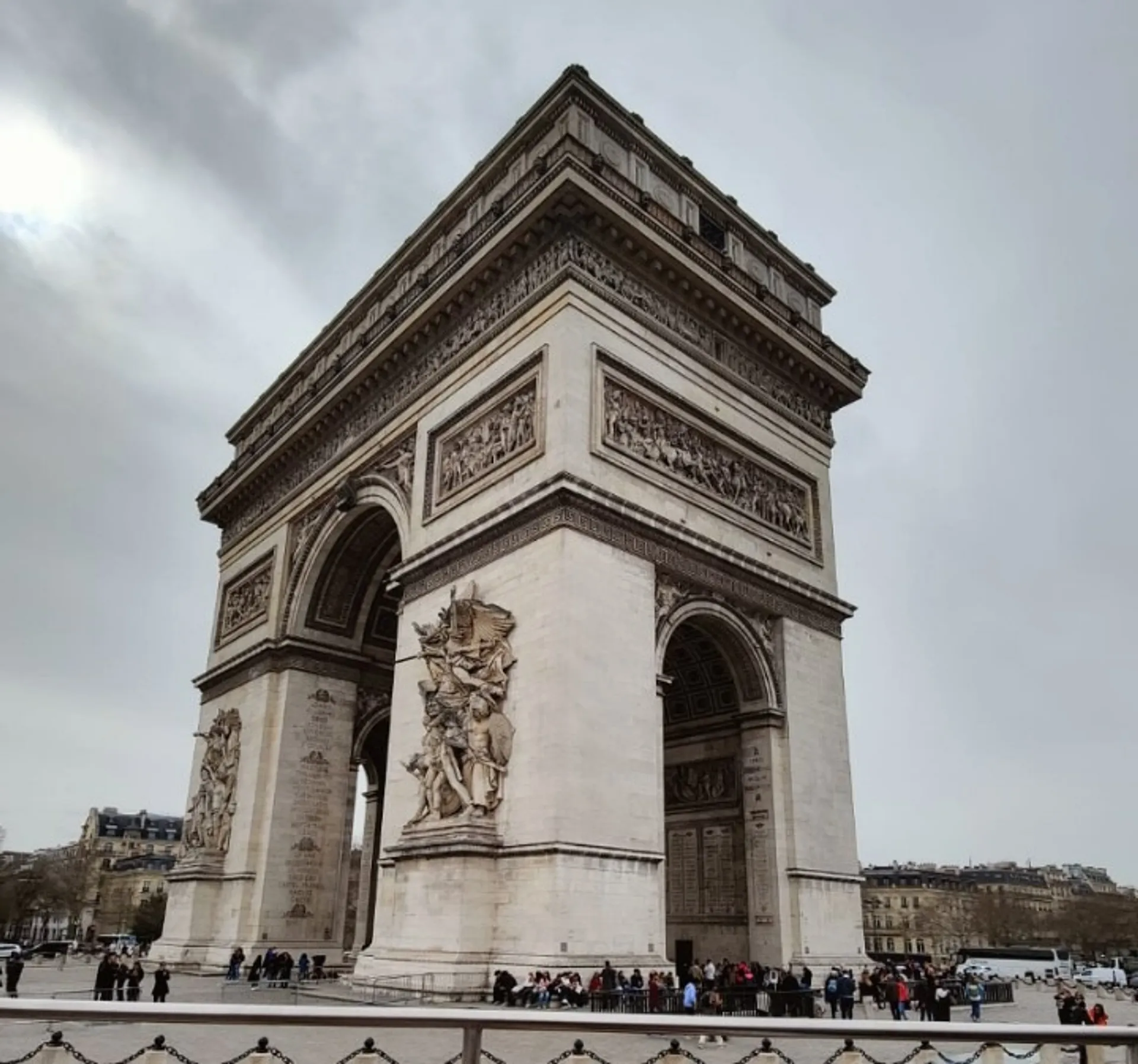 Visitors gather around the iconic Arc de Triomphe in Paris.