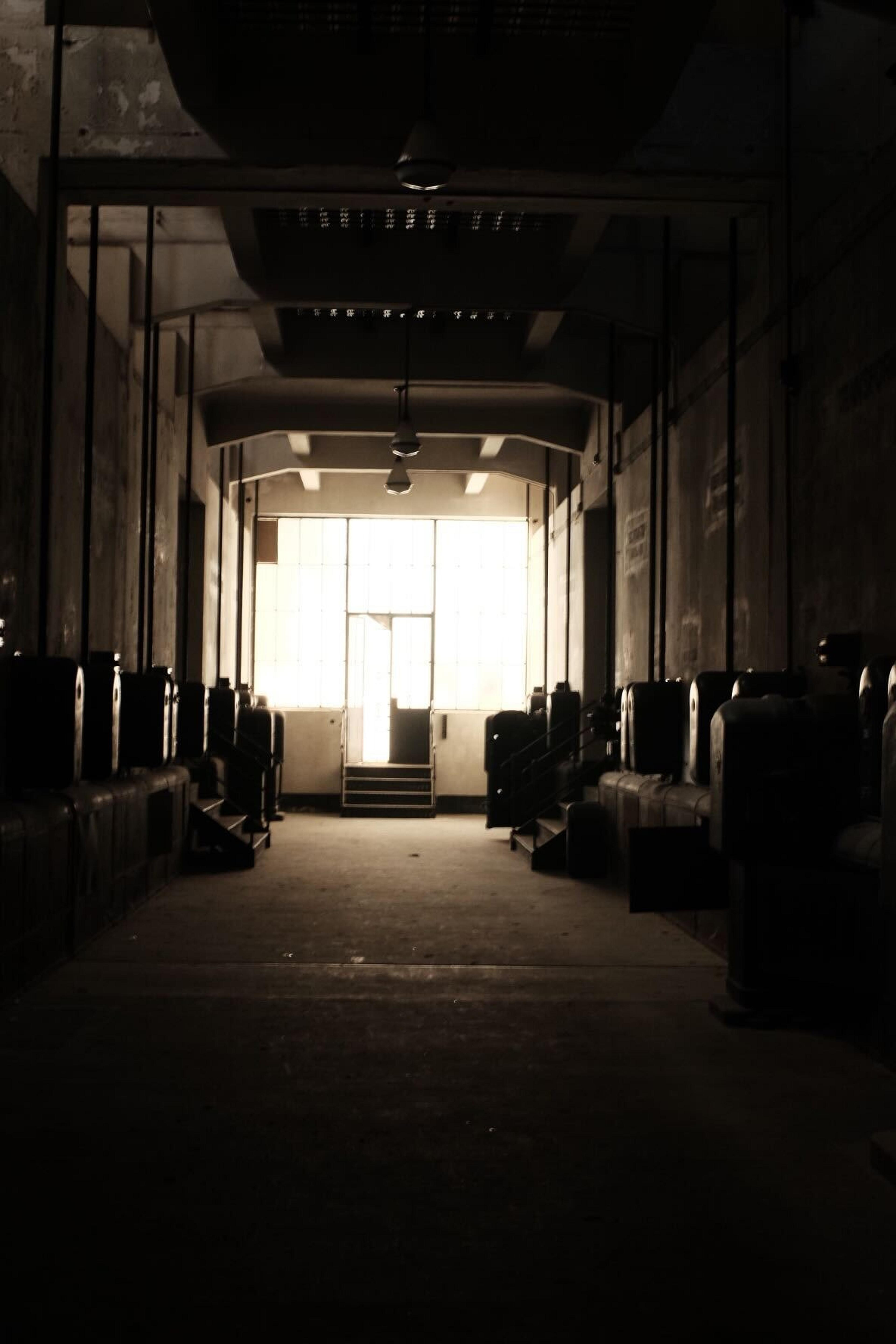 Dark halls of Kelenfold Power Plant illuminated by the sun