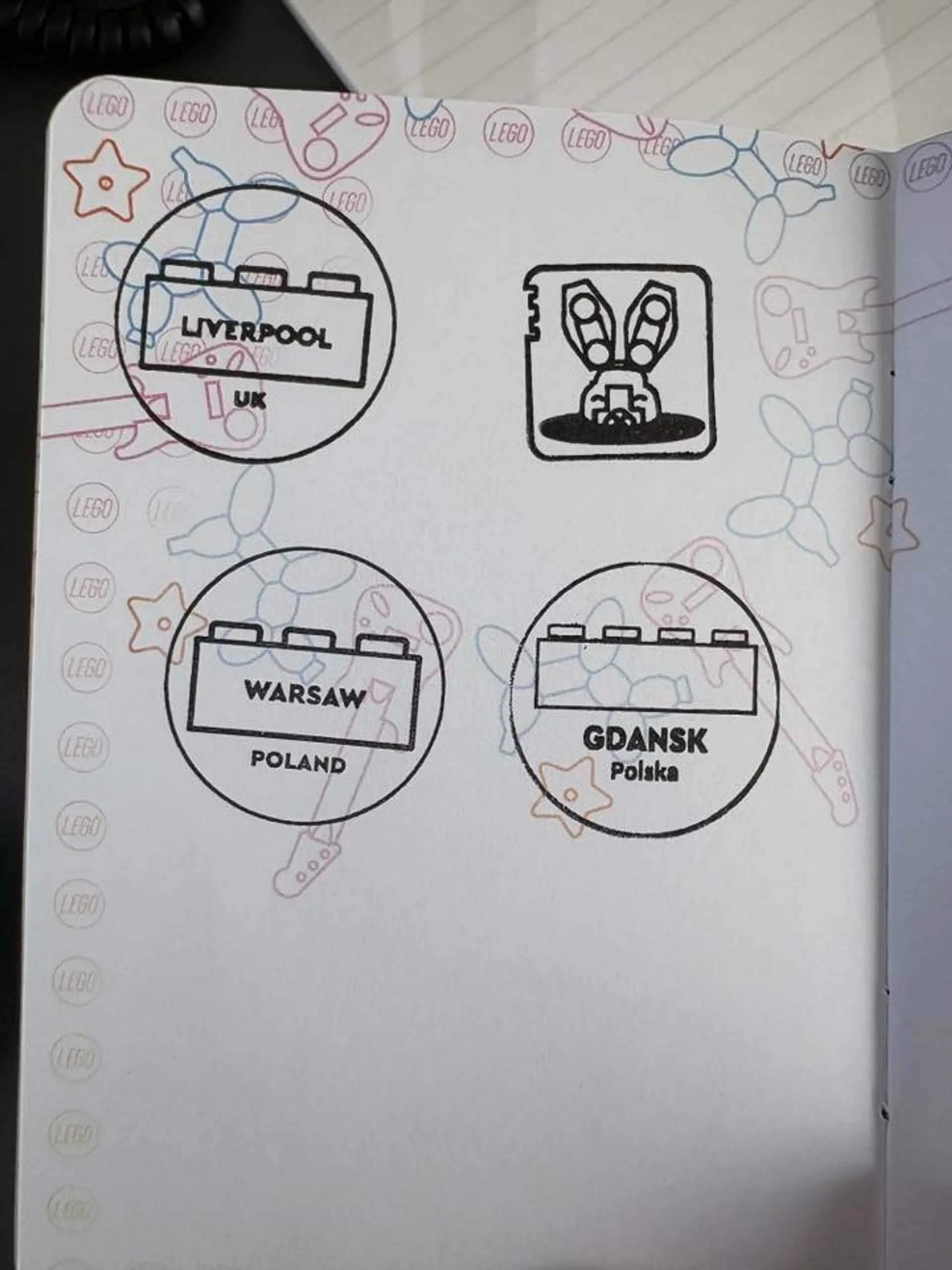 A collection of LEGO-themed stamps featuring Liverpool in the UK, and Warsaw and Gdańsk in Poland.