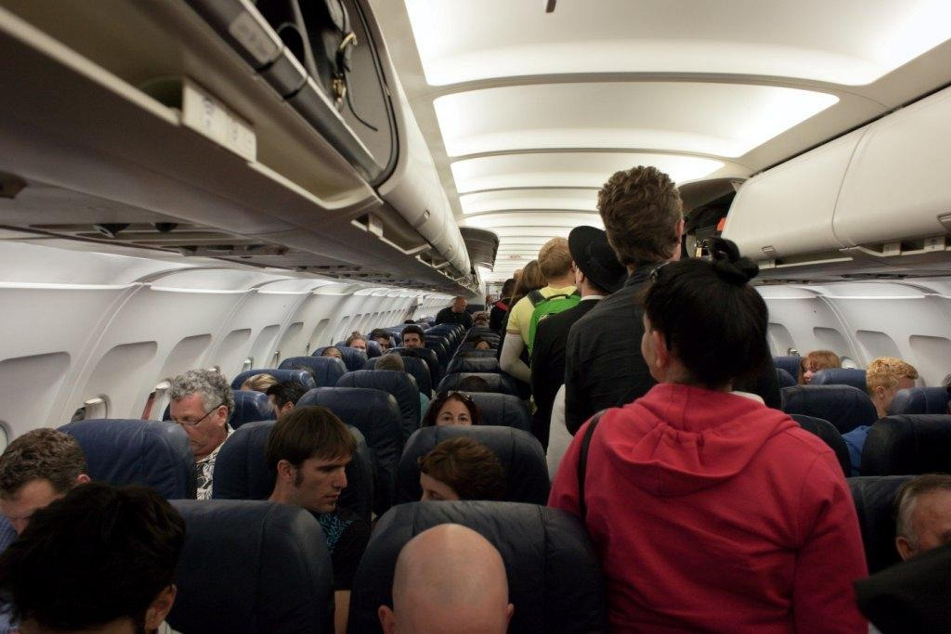 People boarding a busy flight