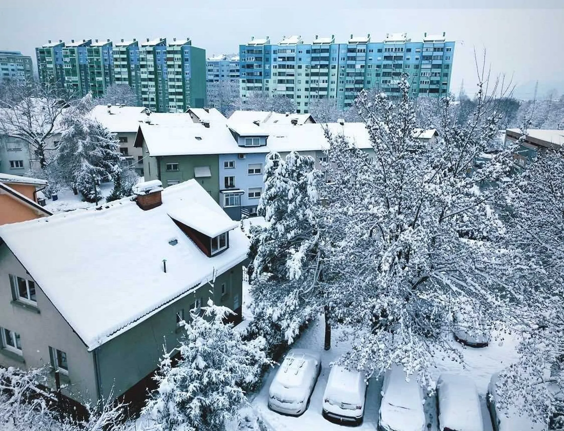 Winter blankets apartment buildings and houses with snow in Ruda Śląska, Poland.