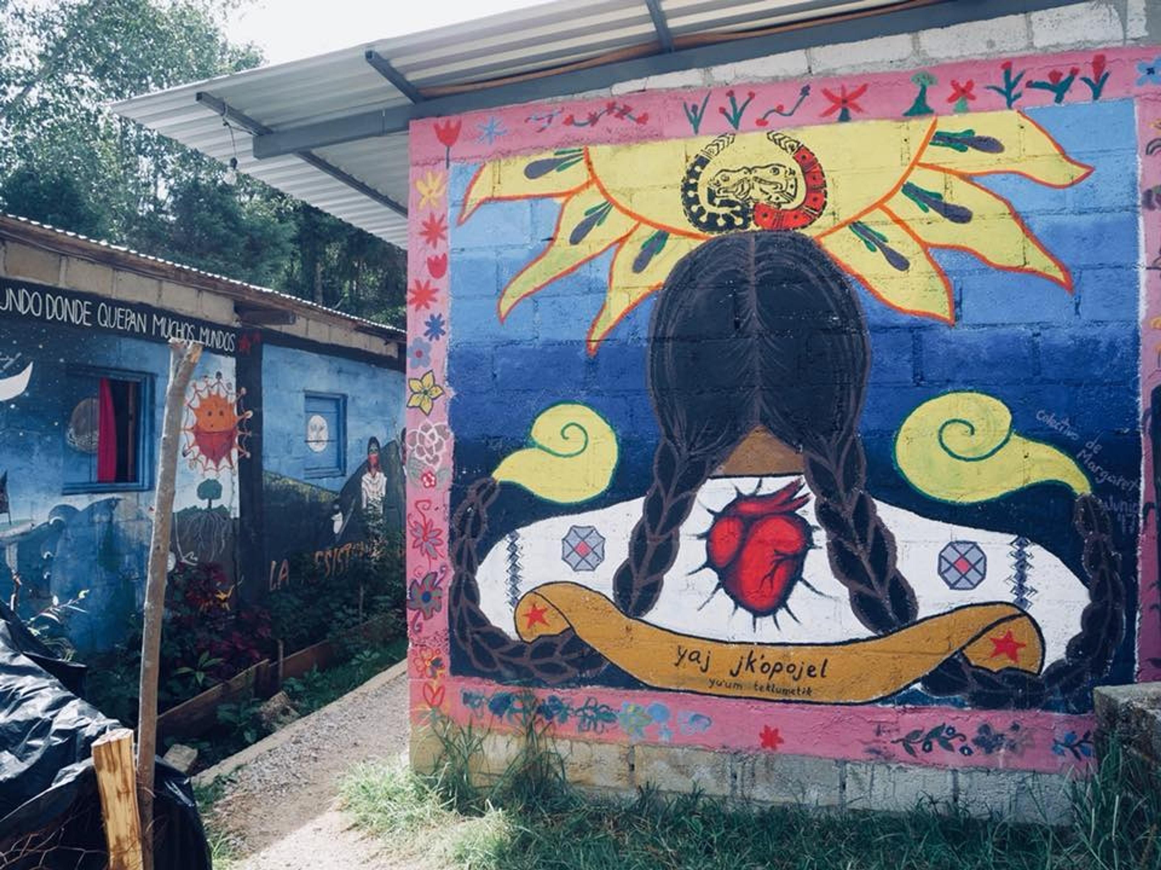 Vibrant murals depicting local culture adorn the walls of Oventic, an autonomous village in Mexico.