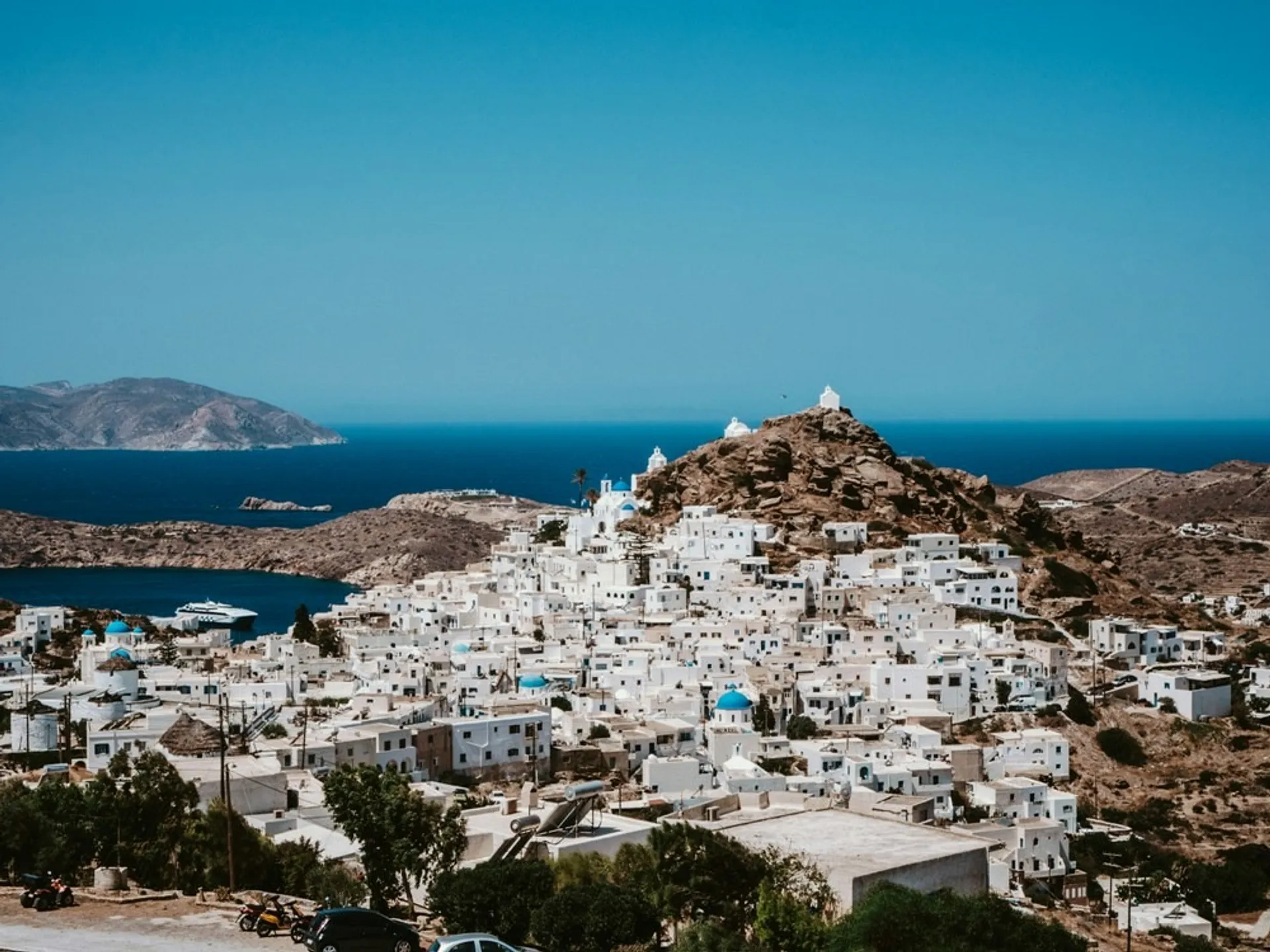 White buildings with a fortess on a hill above
