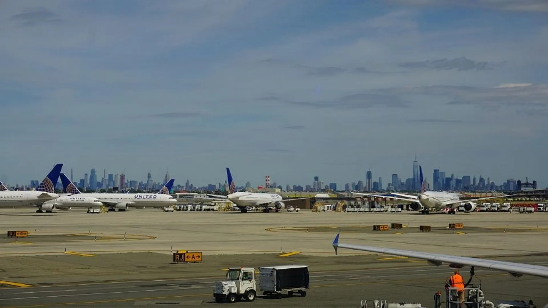Planes at Newark Airport with NYC skyline in the background