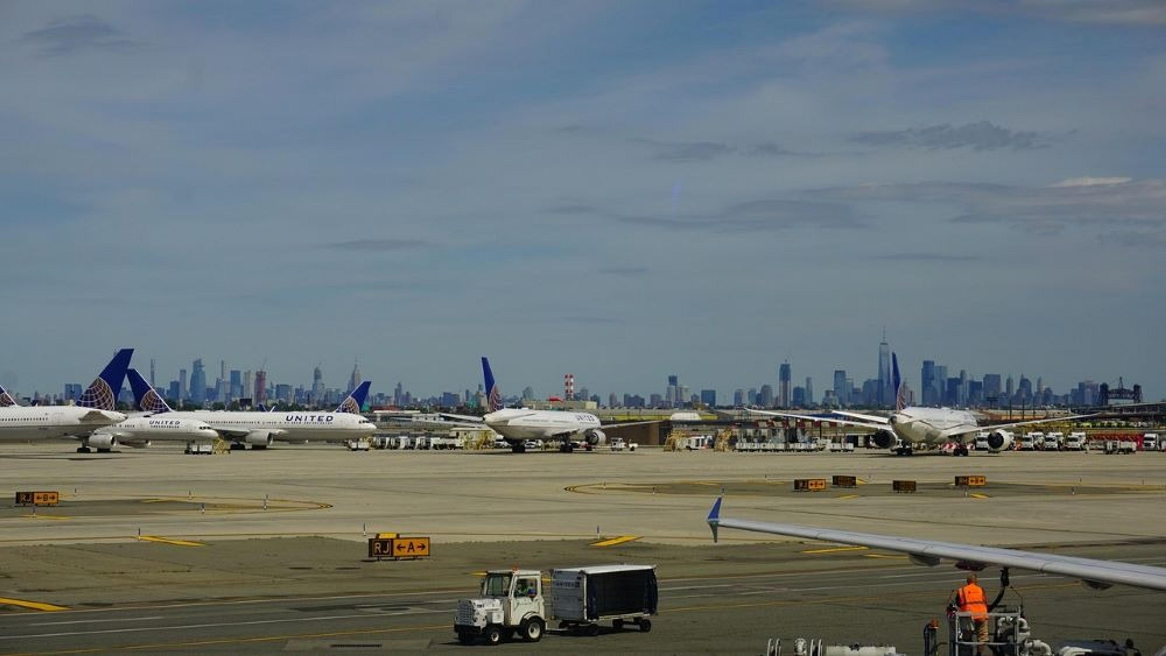 Planes at Newark Airport with NYC skyline in the background