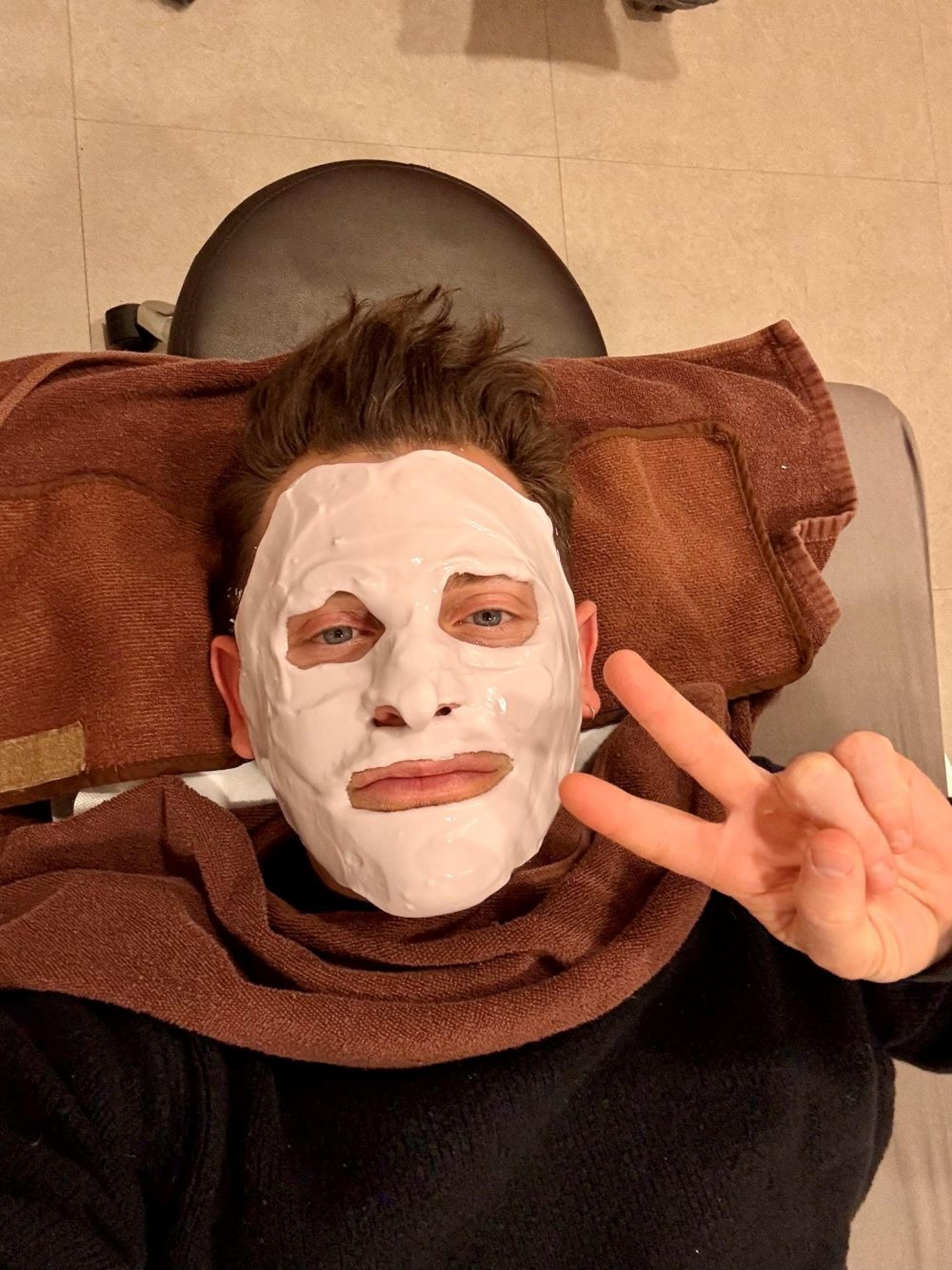 Nicky in a face mask in Korea