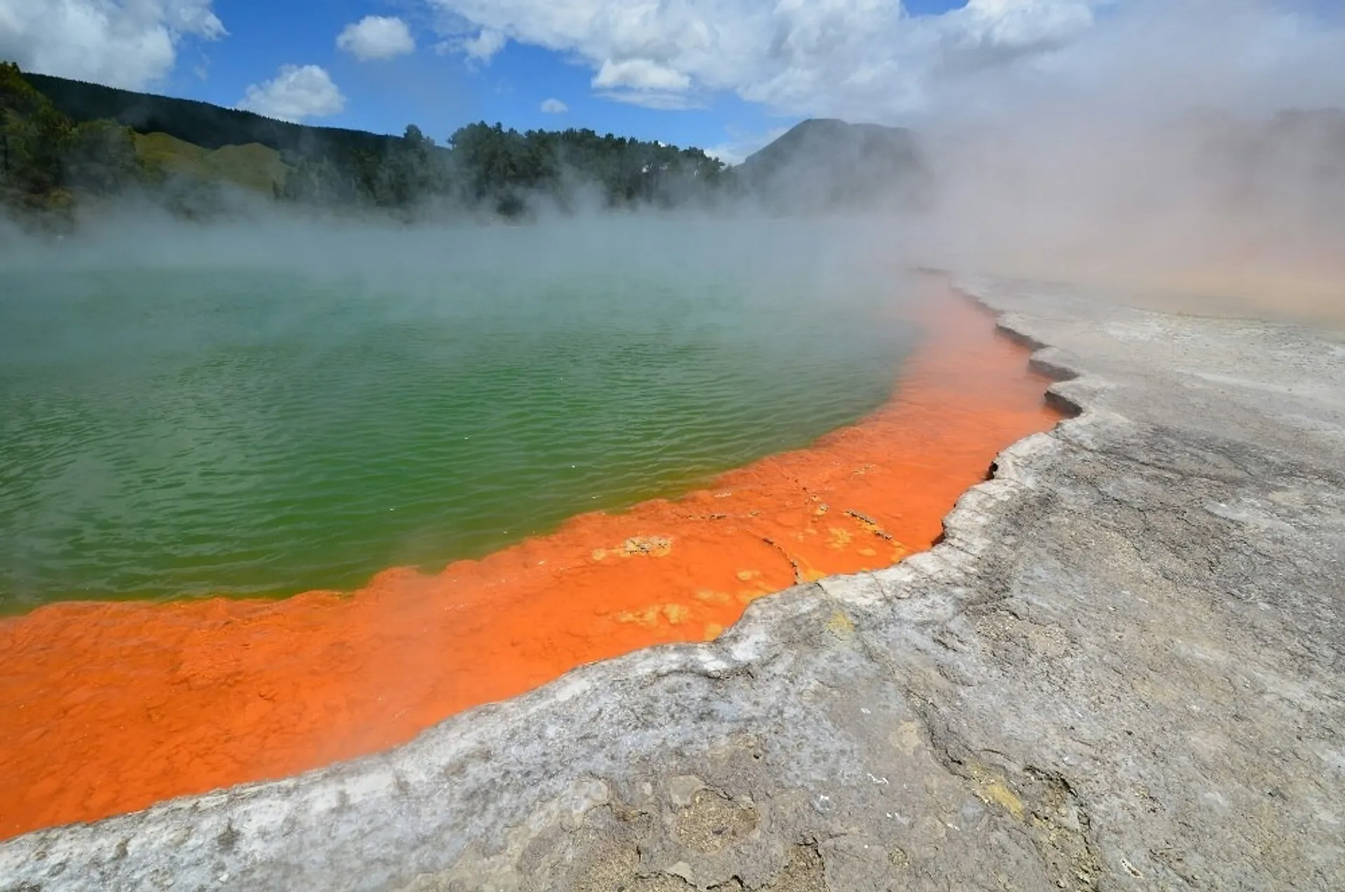 Sulfuric lake with steam rising