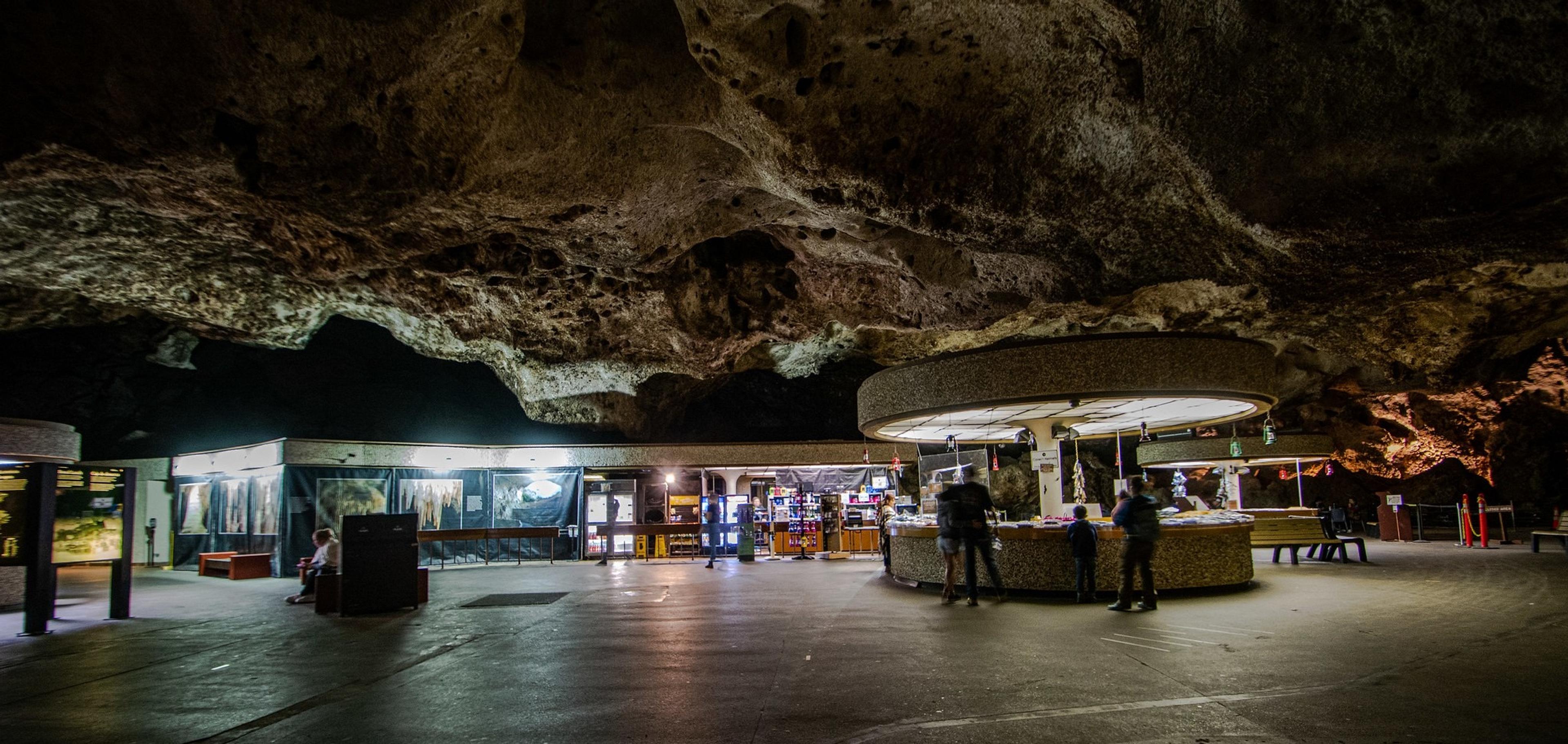 A cavernous interior with a modern visitor center and gift shop set within Carlsbad Caverns in New Mexico.