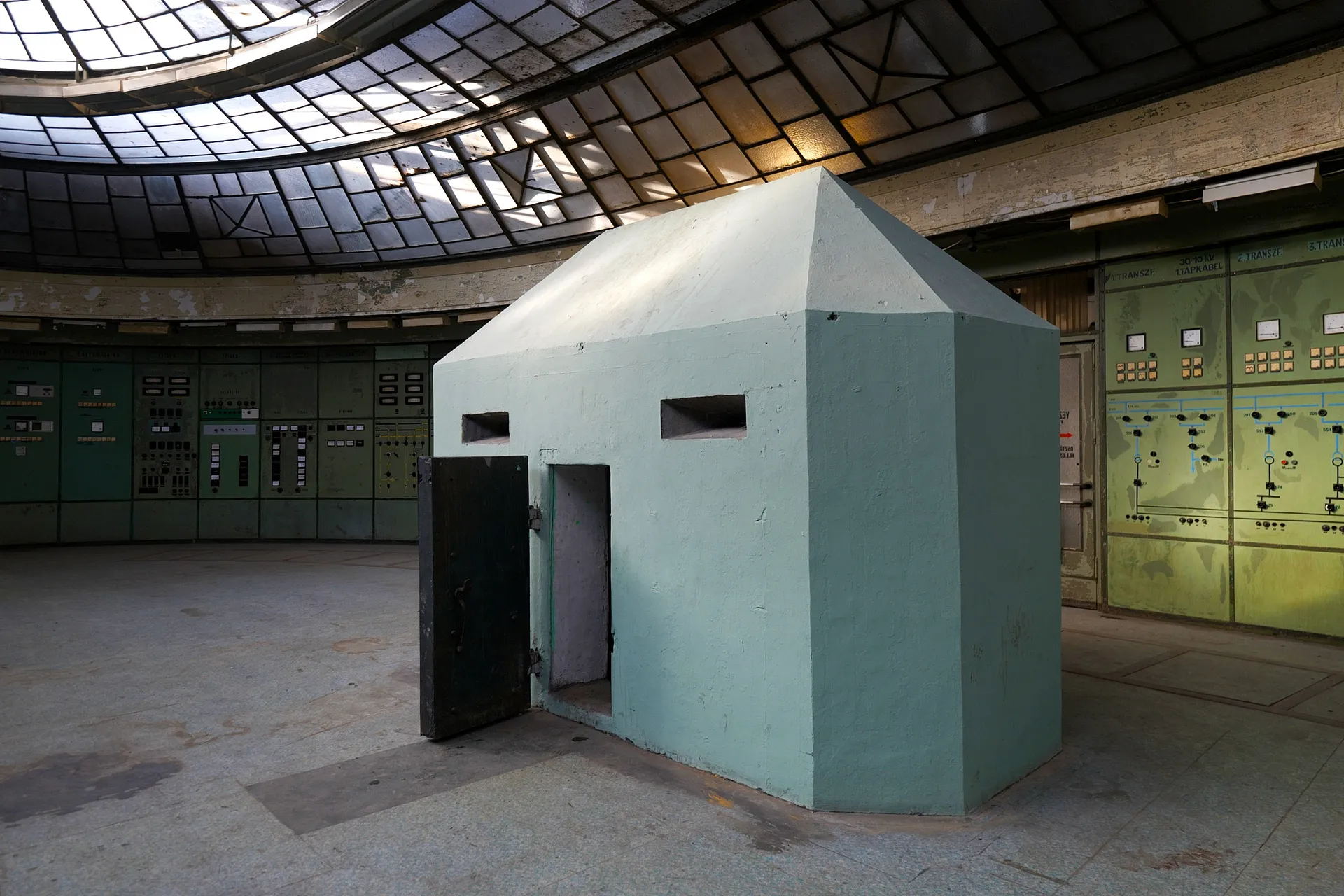 An above ground nuclear bunker sits underneath the control room's glass skylight.