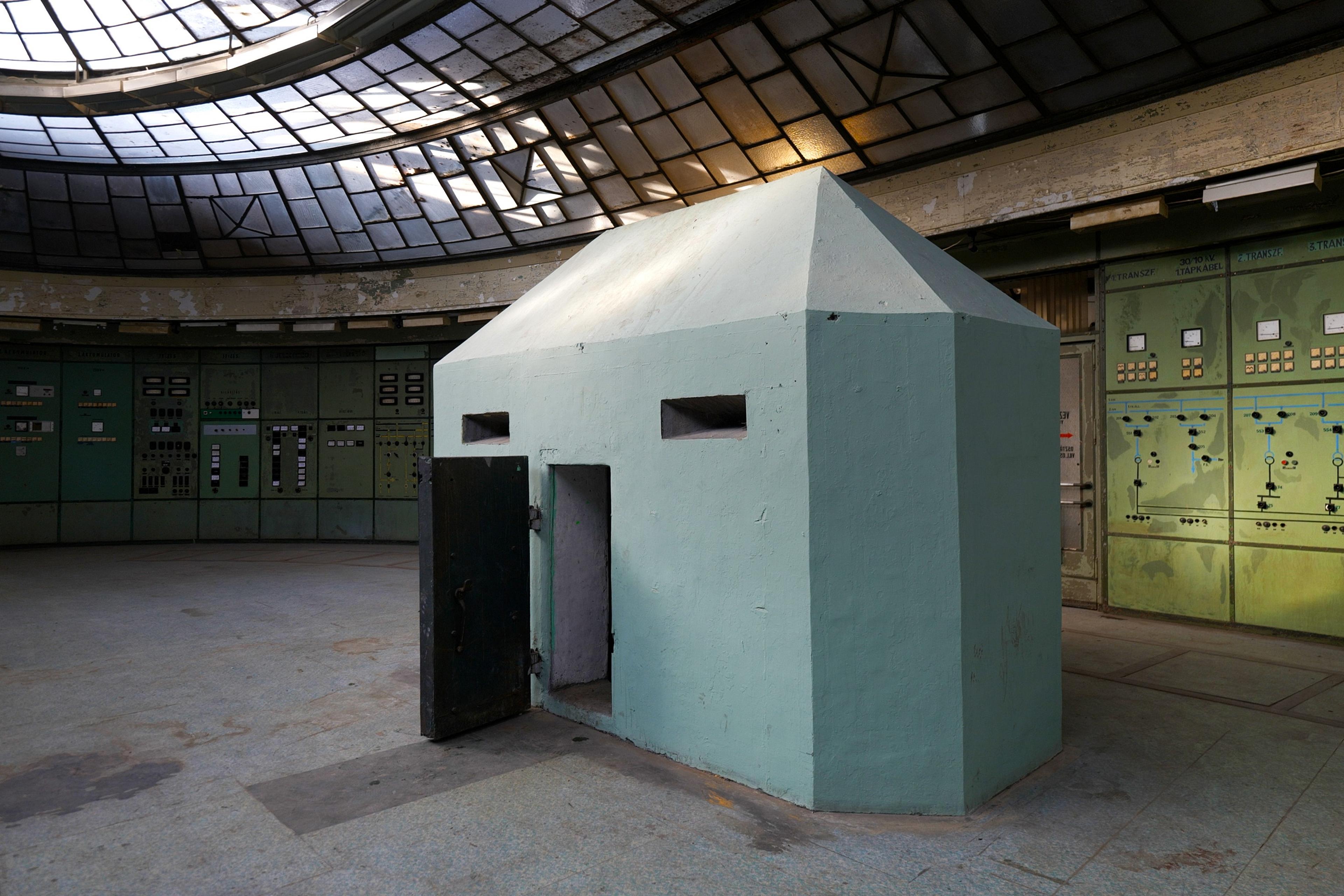 An above ground nuclear bunker sits underneath the control room's glass skylight.