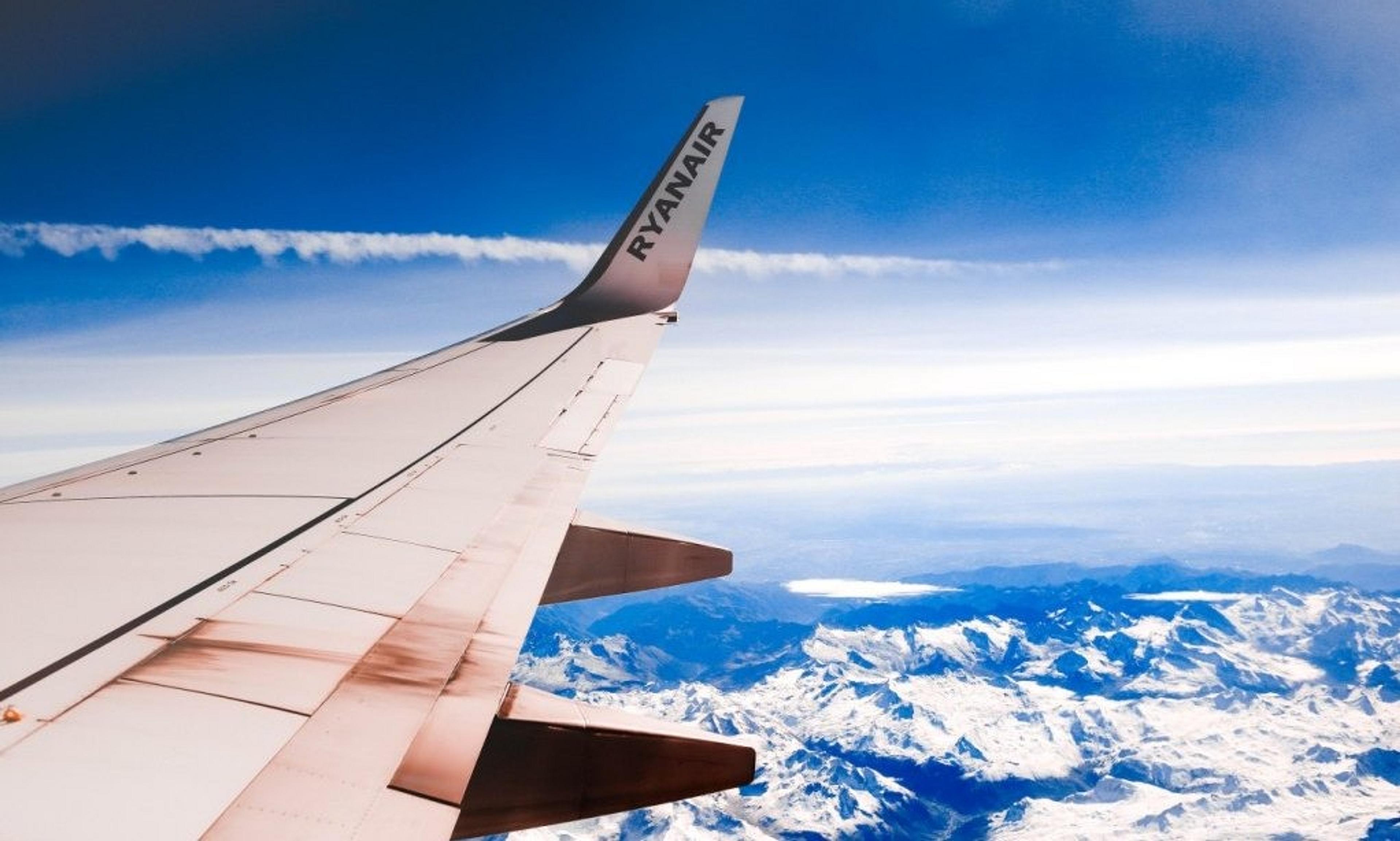 Ryanair plane wing above mountains