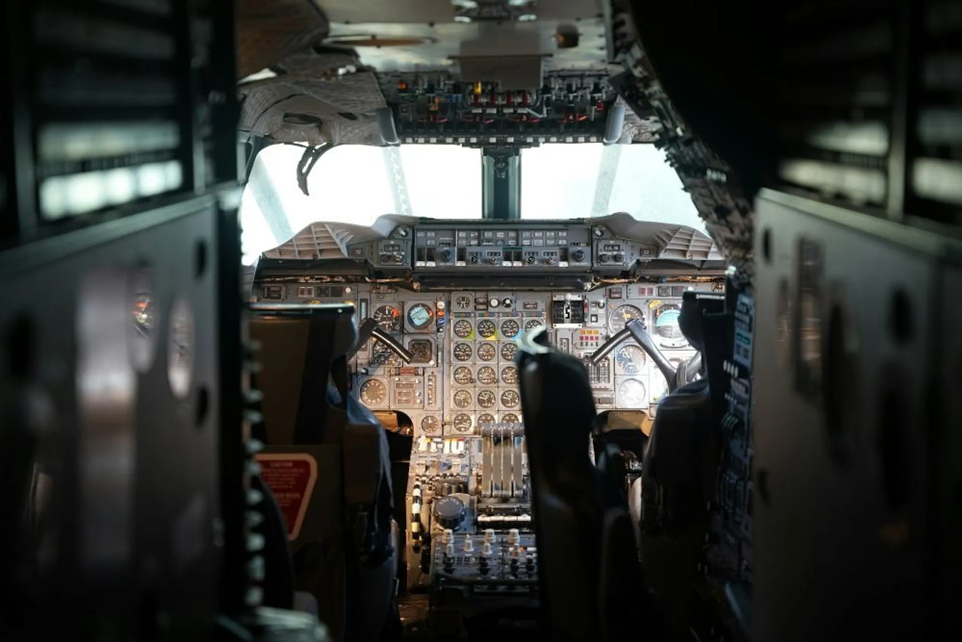 The cockpit of a Concorde aircraft displays a complex array of gauges and controls.