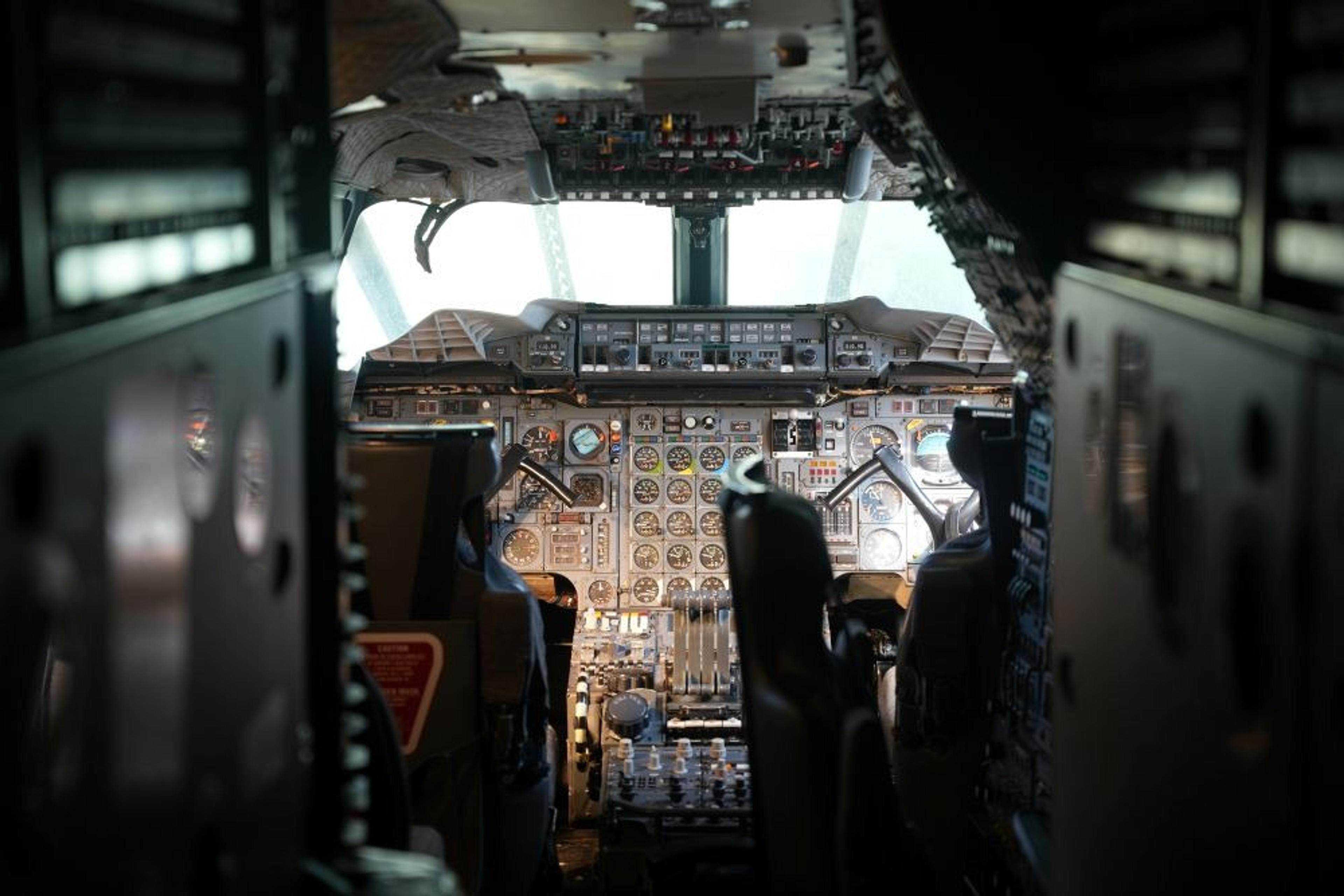 The cockpit of a Concorde aircraft displays a complex array of gauges and controls.