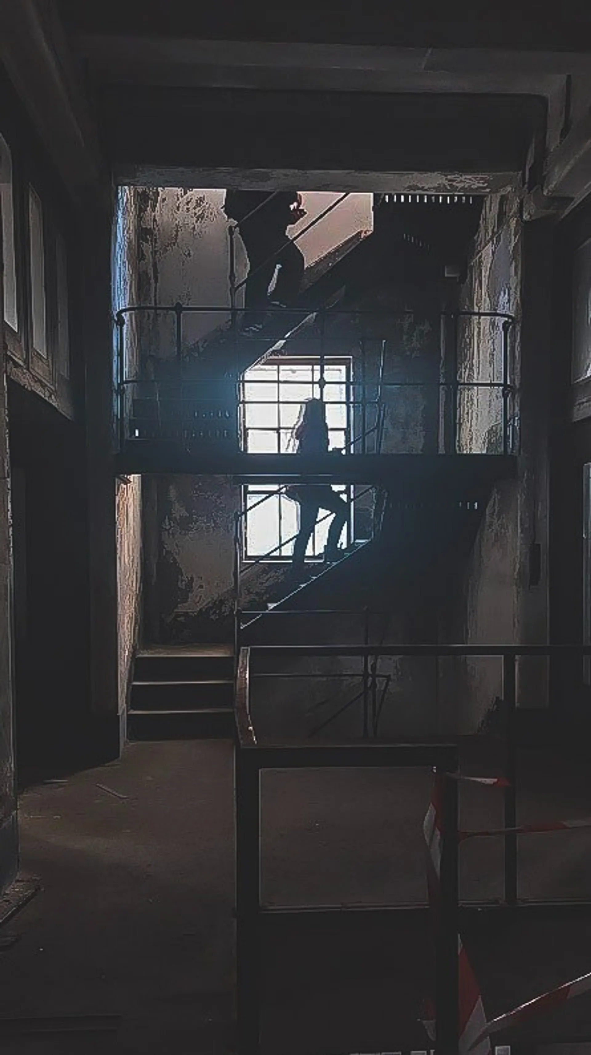 Simon and writer Akasha climbing the factory's staircase