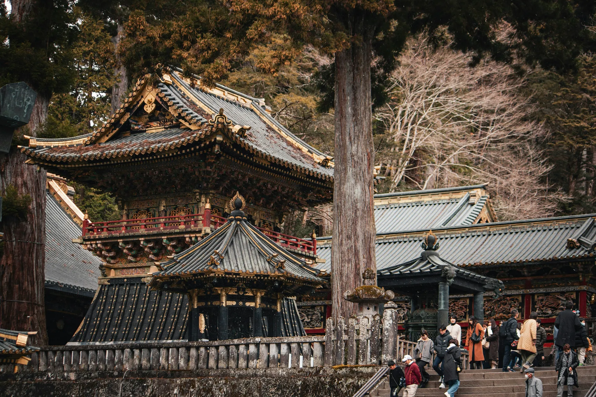 Visitors explore the ornate and historical Toshogu Shrine in Nikko, Japan.