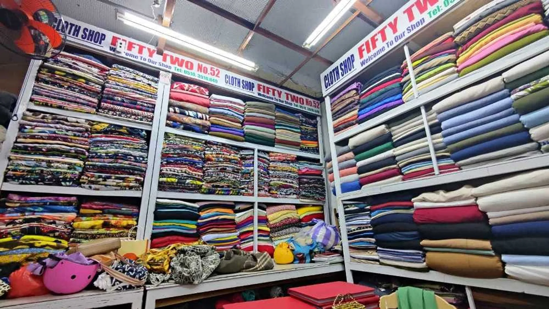 Walls piled high with fabrics