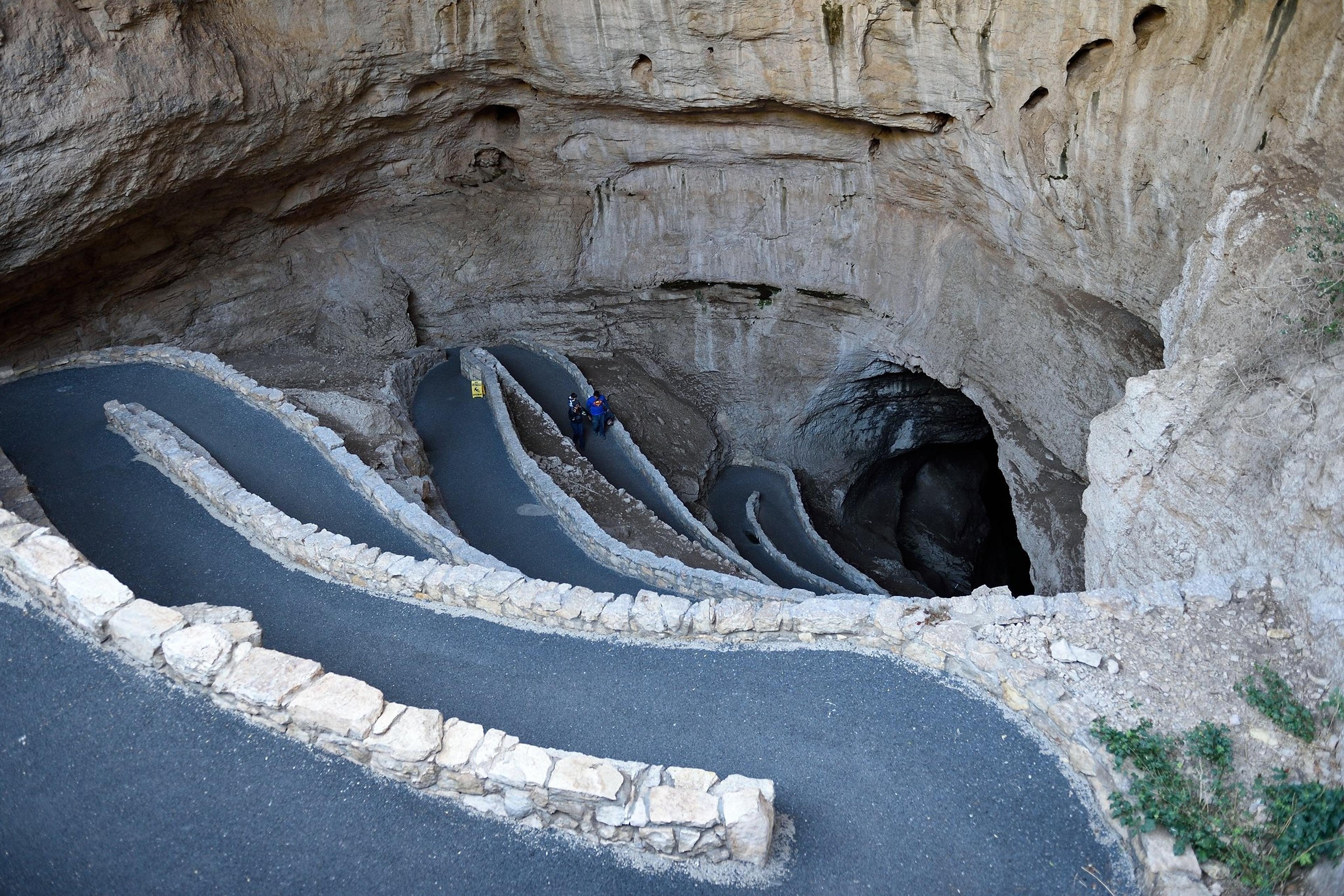 A winding path leads into the depths of Carlsbad Caverns National Park in New Mexico.