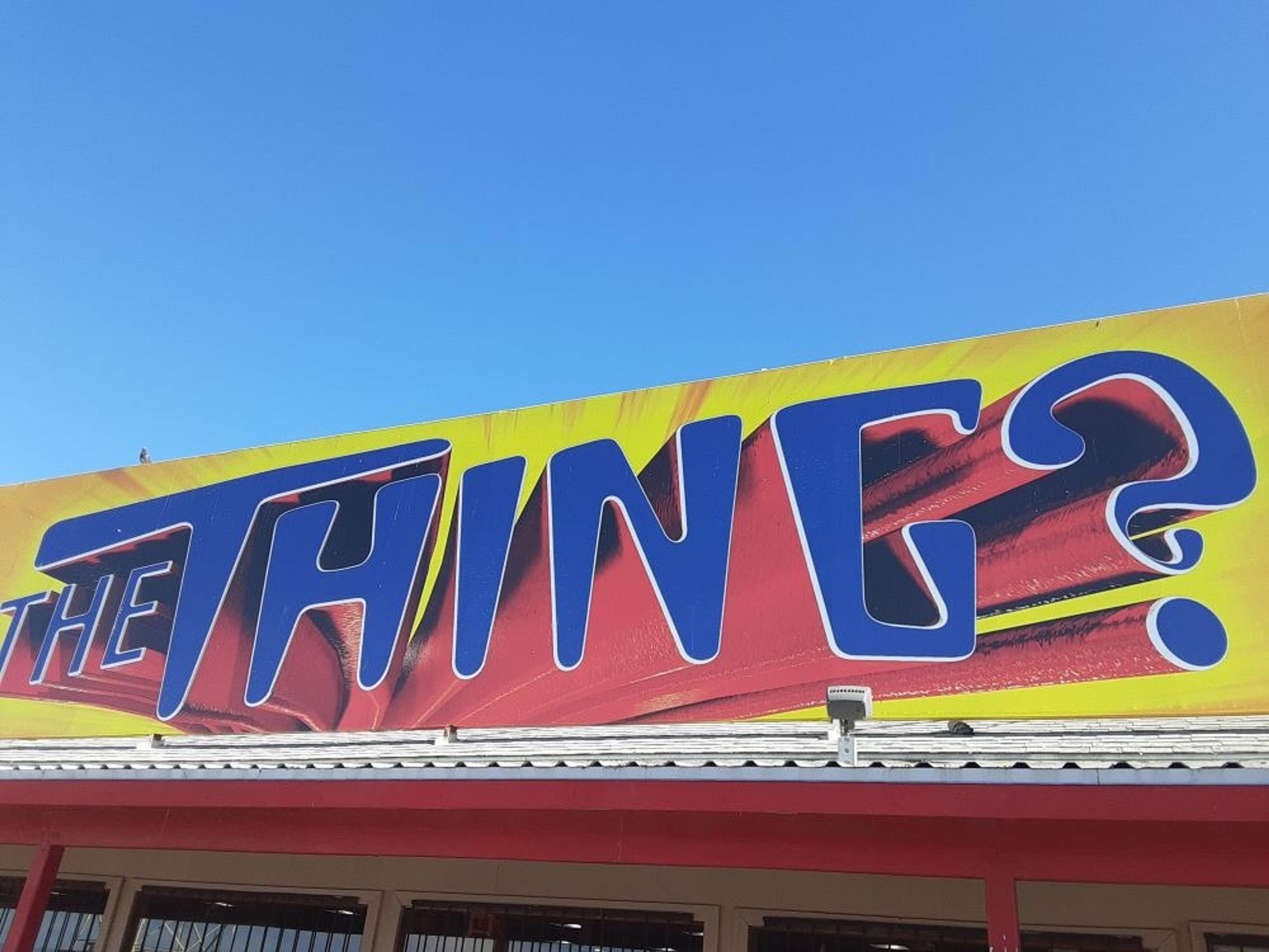 Yellow sign reading, "THE THING?" 